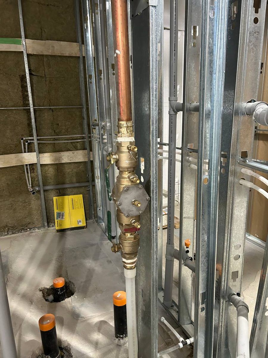 A code-compliant backflow preventer installation on a commercial property serving Aurora